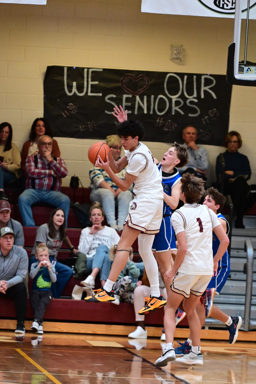 Royce Castle catching the ball in the lane near the rim